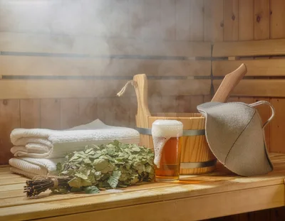 Sauna Accessories With Beer On Wooden Bench