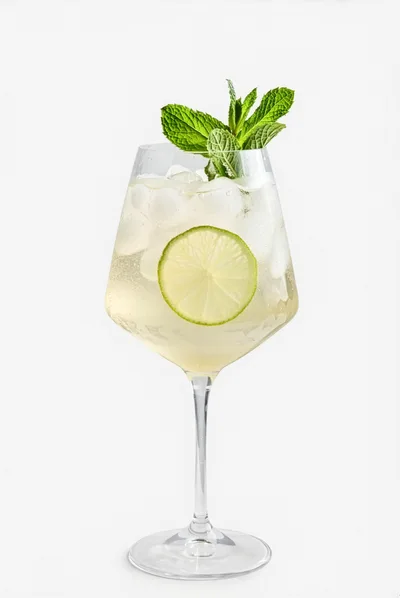 Refreshing Lime And Mint Cocktail In A Wine Glass