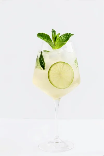 Refreshing Lime and Mint Cocktail in Wine Glass