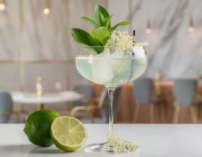 Refreshing Elderflower Cocktail With Lime And Mint Garnish