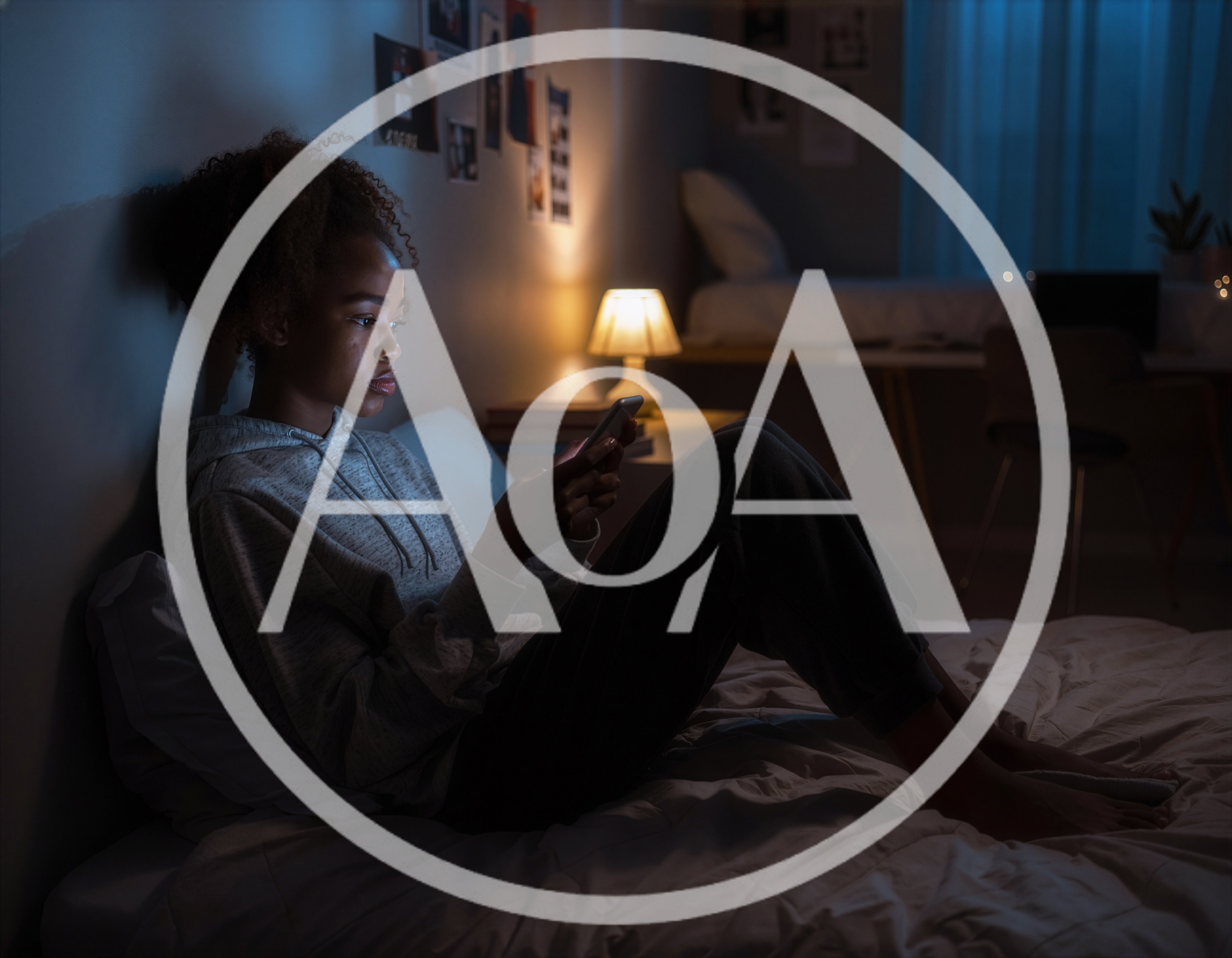 Young Woman Using Smartphone In Bed At Night