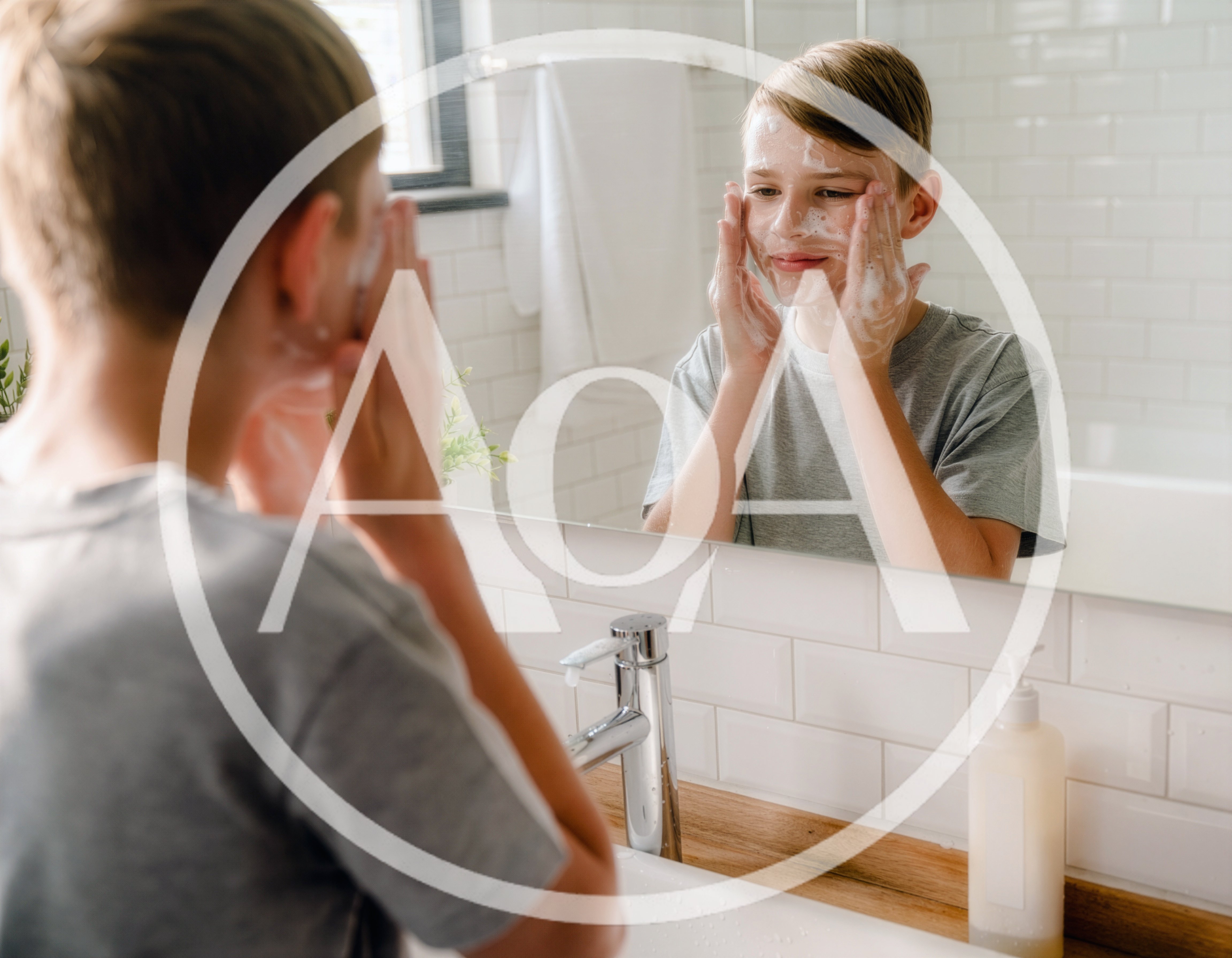 Young Boy Washing Face With Soap In Bathroom Mirror