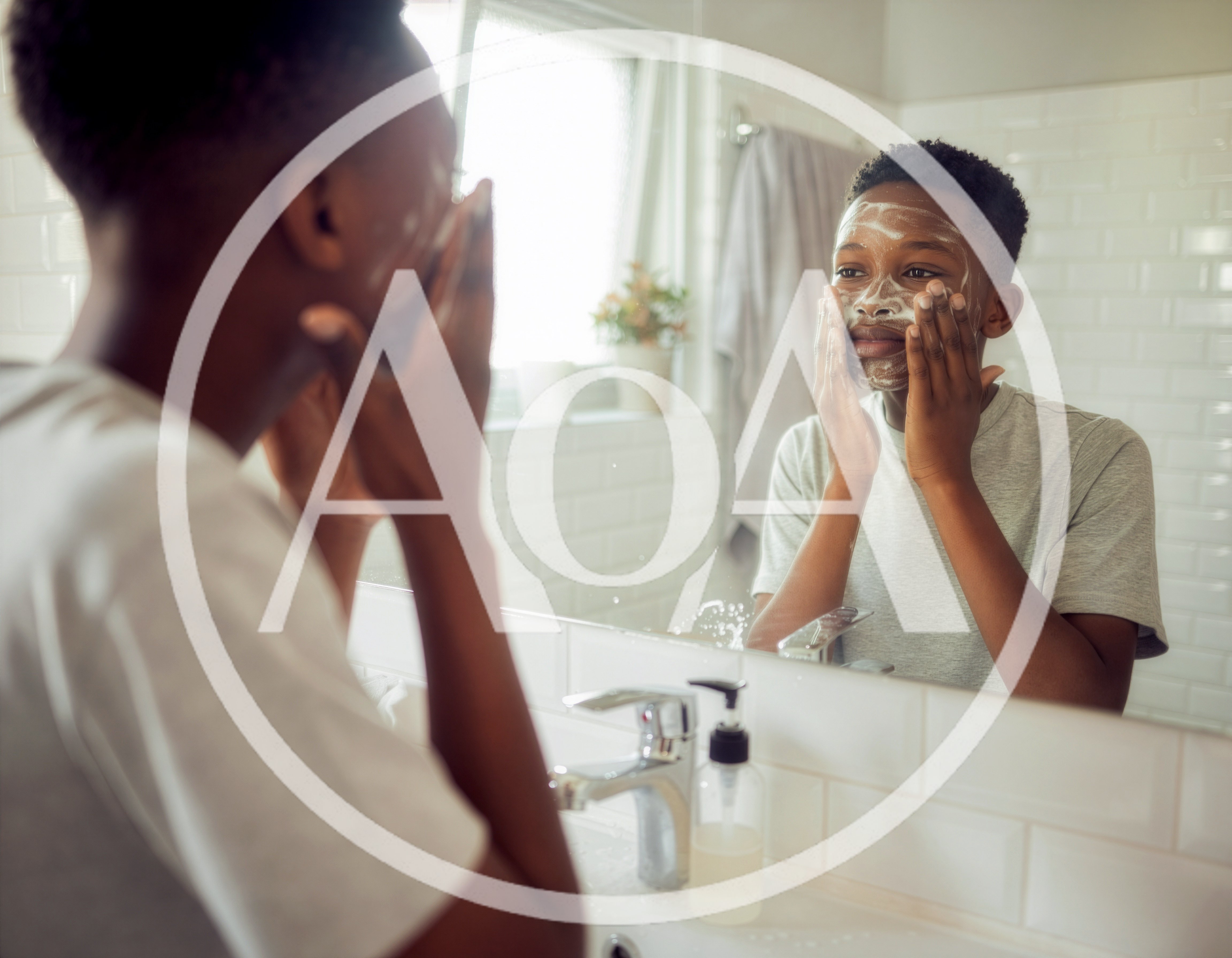 Young African American Boy Washing Face In Bathroom Mirror