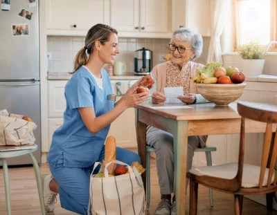 Caregiver Assisting Elderly Woman With Grocery Shopping