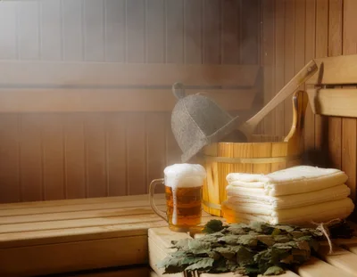 Beer Mug and Sauna Accessories on Wooden Bench