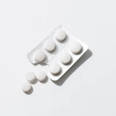 White Pills In Blister Pack On White Background