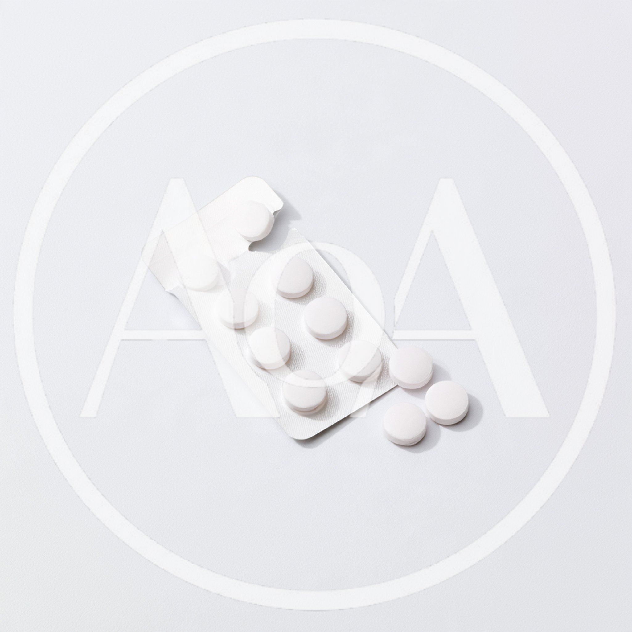 White Pills In A Blister Pack On White Background