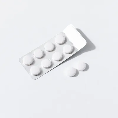 White Pills In A Blister Pack On White Background