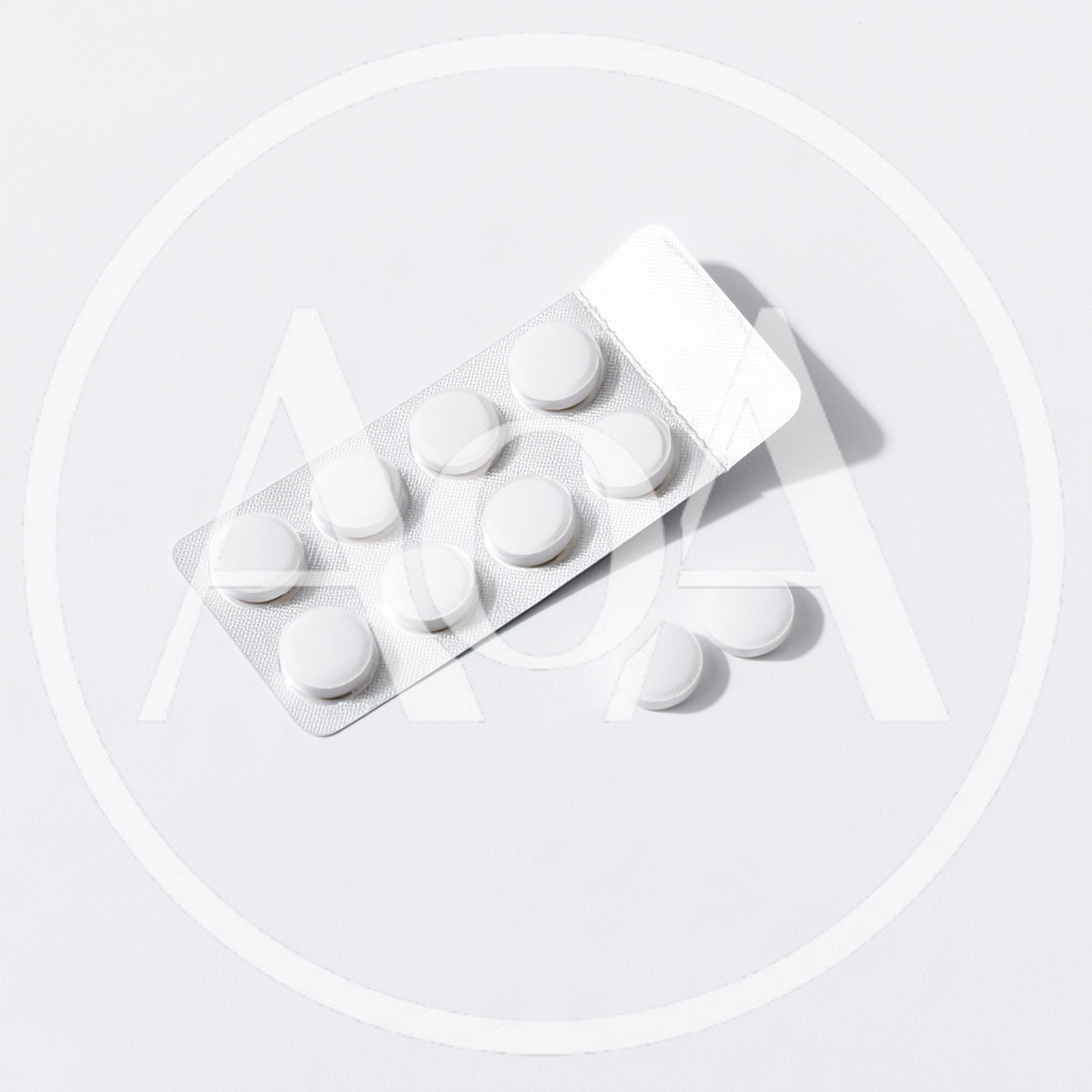 White Pills In A Blister Pack On White Background