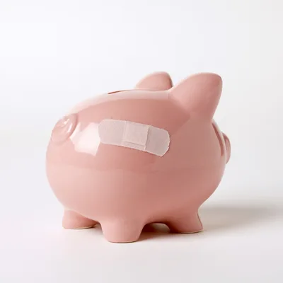 Pink Piggy Bank With Adhesive Bandage