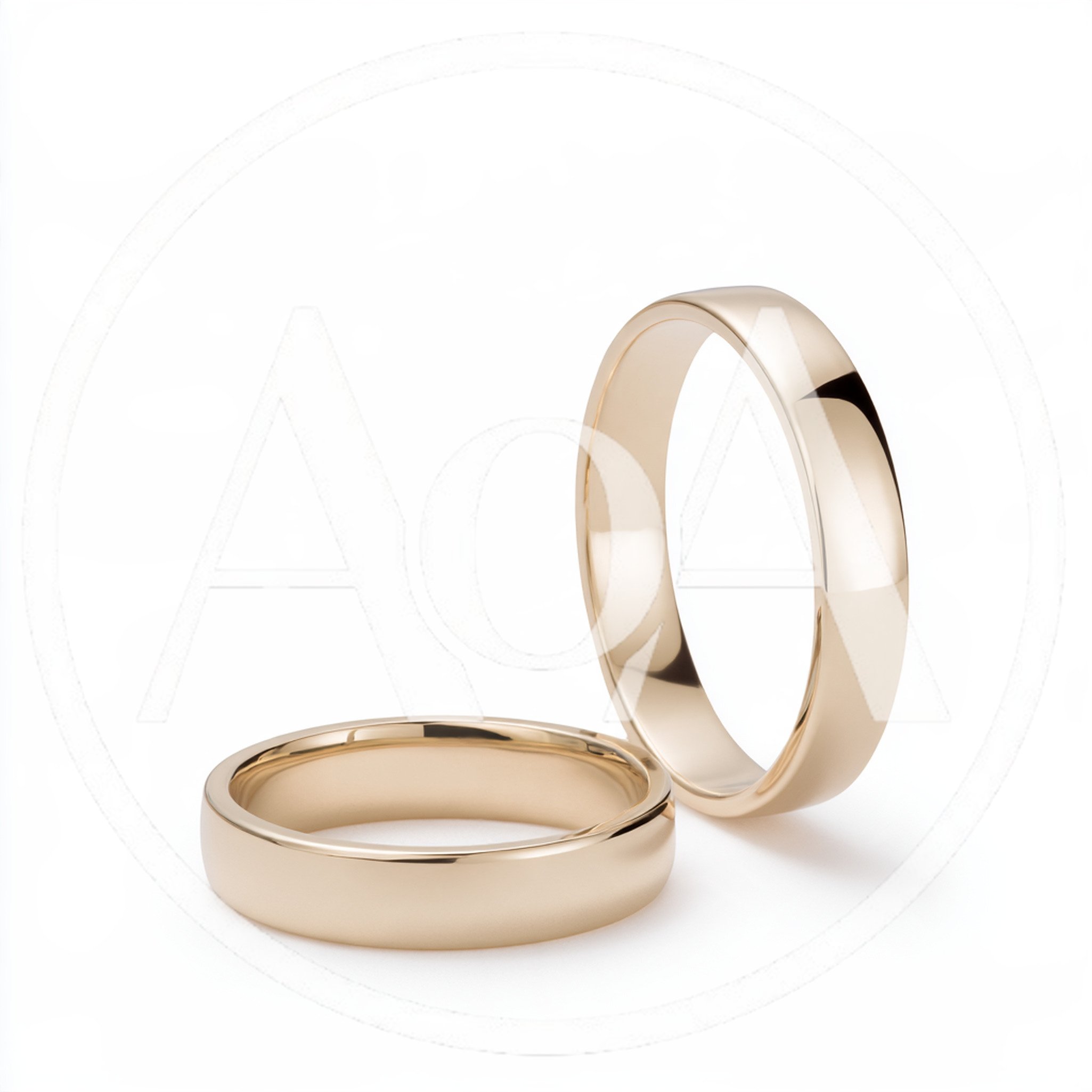 Two Classic Gold Wedding Bands On White Background