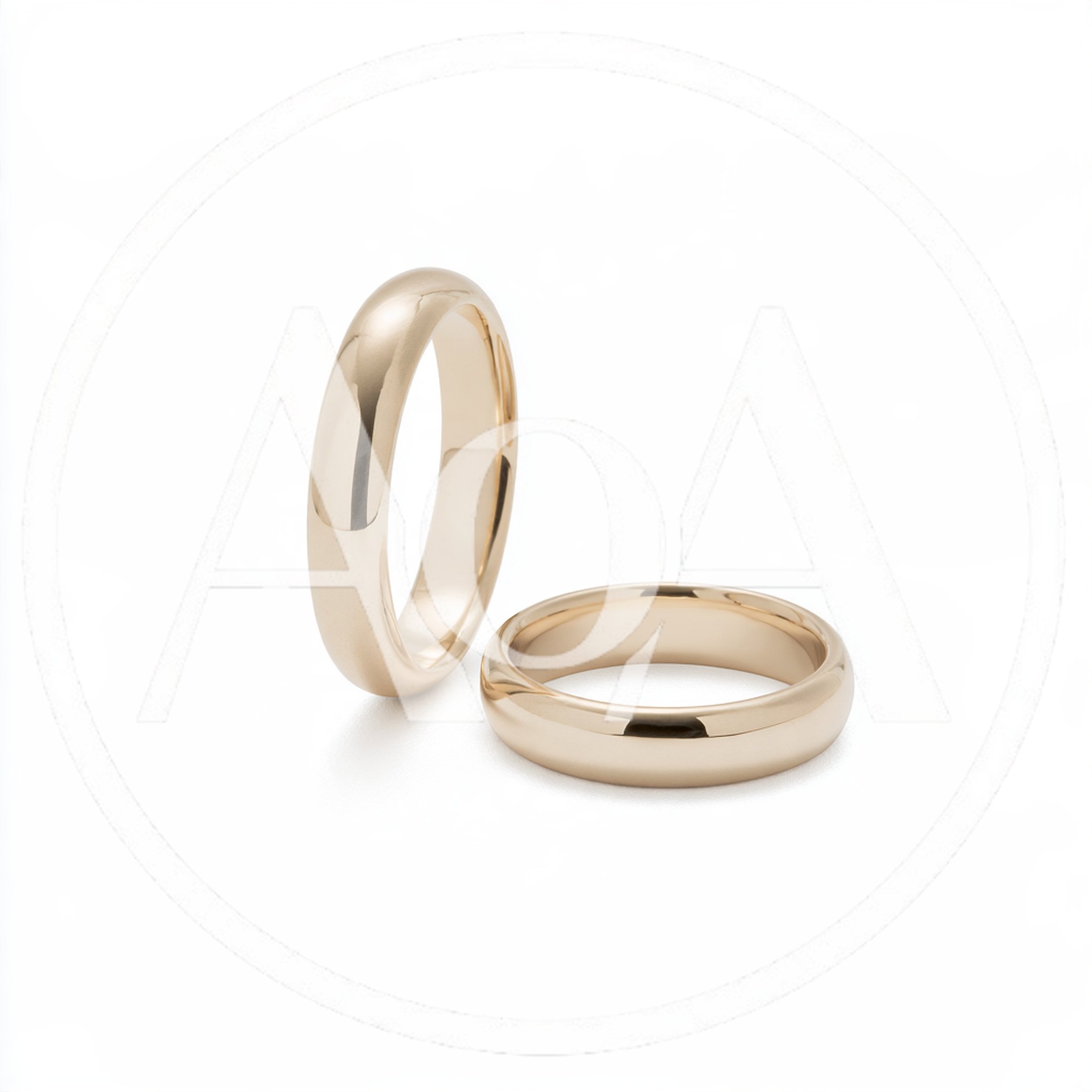 Two Classic Gold Wedding Bands On White Background