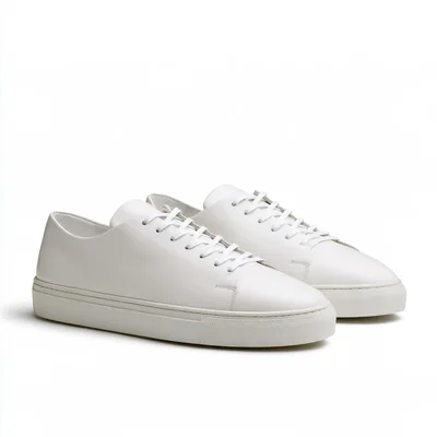 Pair Of Minimalist White Leather Sneakers