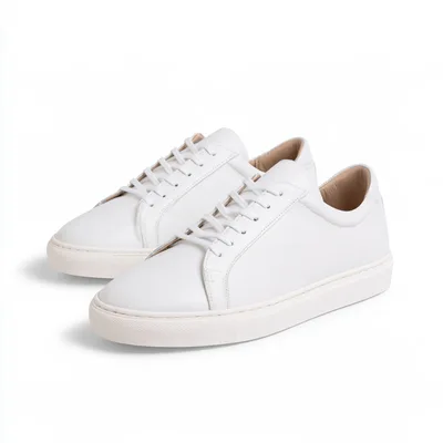 Pair Of Minimalist White Leather Sneakers