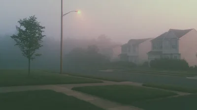 Suburban Street Scene During A Dense Morning Fog