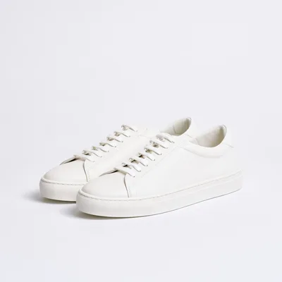 Pair Of Minimalist White Leather Sneakers