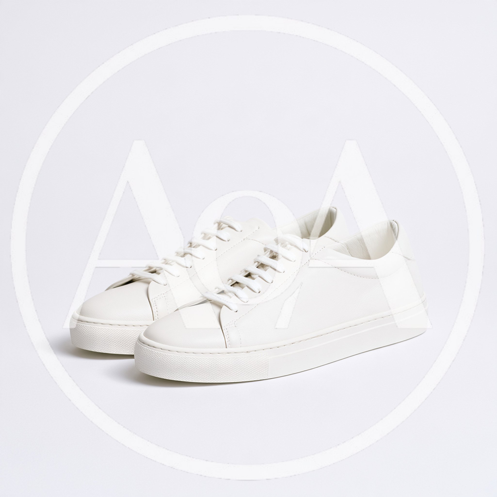Pair Of Minimalist White Leather Sneakers