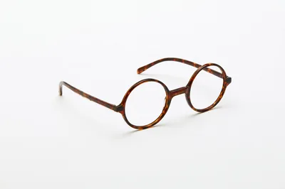 Tortoiseshell Round Frame Glasses On White Background