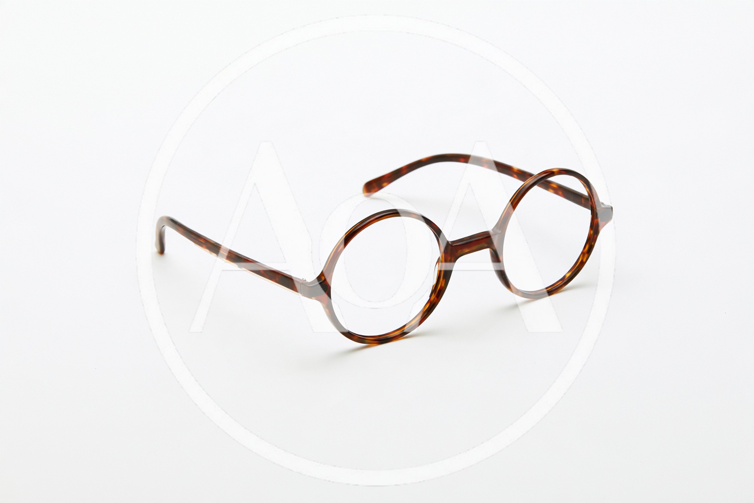 Tortoiseshell Round Frame Glasses On White Background