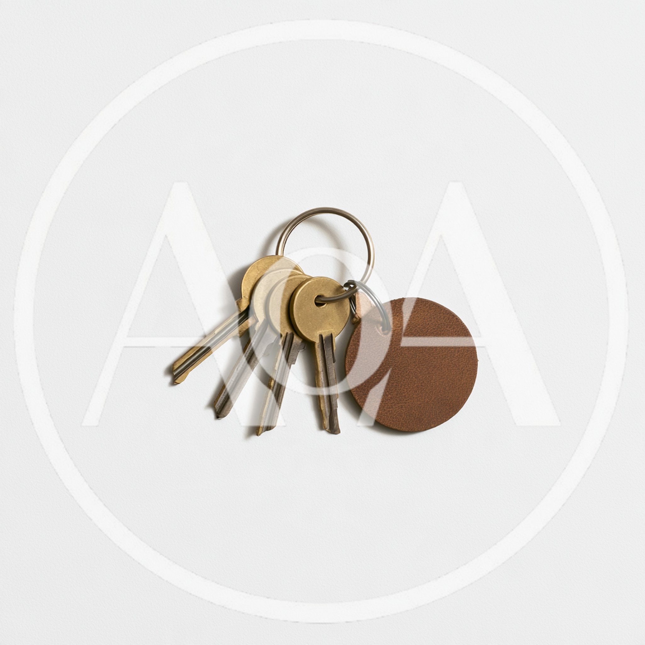 Brass Keys With Leather Tag On White Background