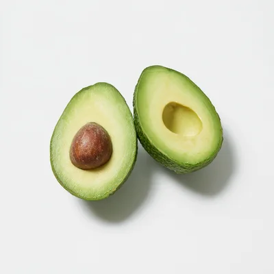 Two Halves Of A Fresh Ripe Avocado
