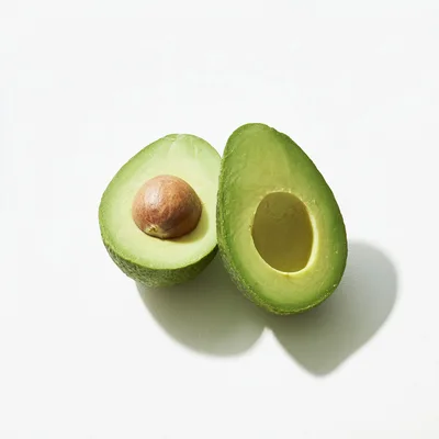 Two Halves Of A Fresh Ripe Avocado