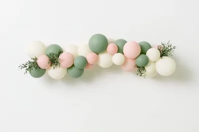Balloon Garland Decoration With Greenery On White Wall