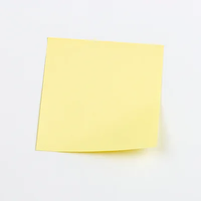 Yellow Sticky Note On A White Background