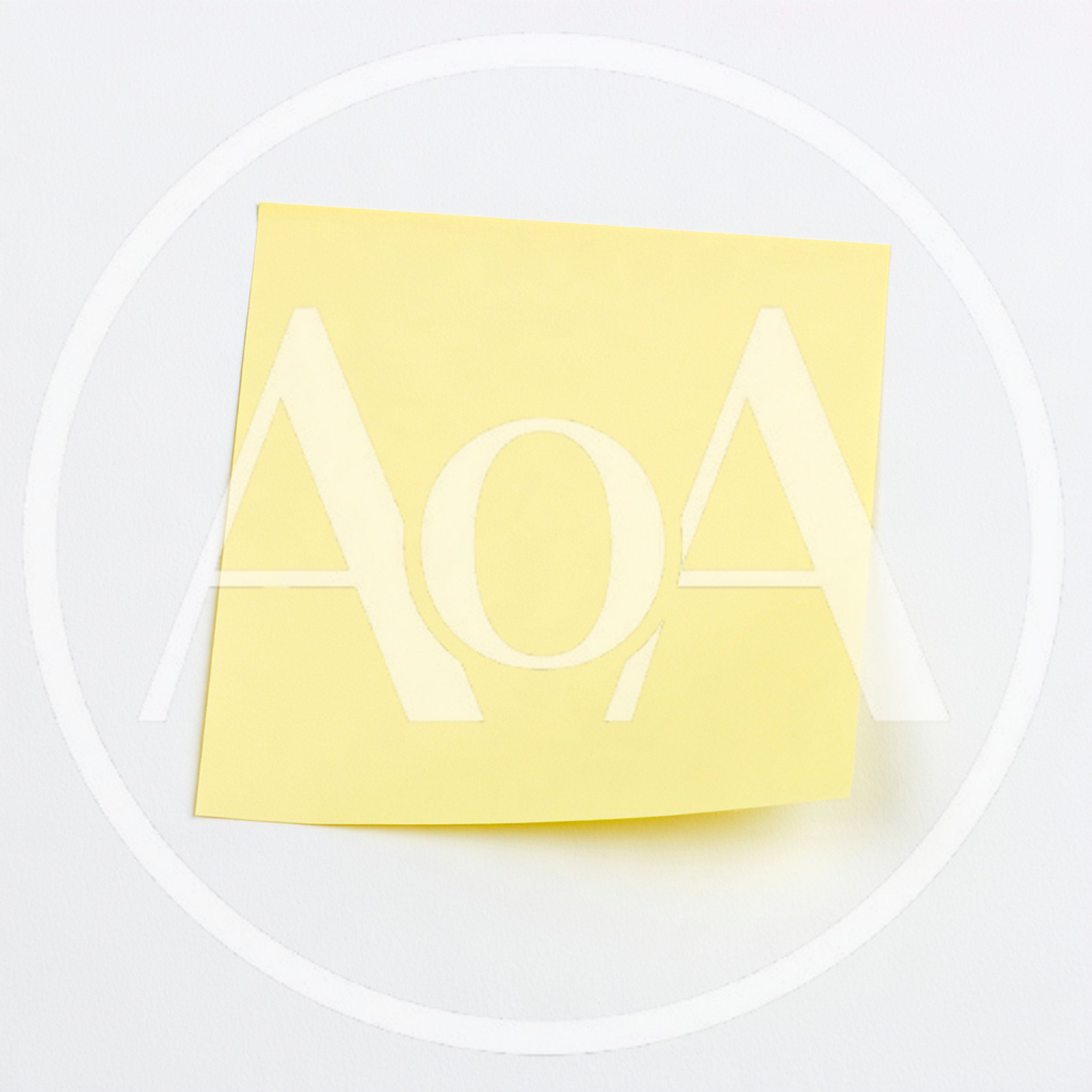 Yellow Sticky Note On A White Background