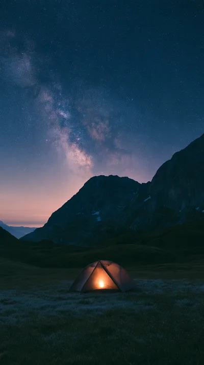 Illuminated Camping Tent Under Milky Way Galaxy