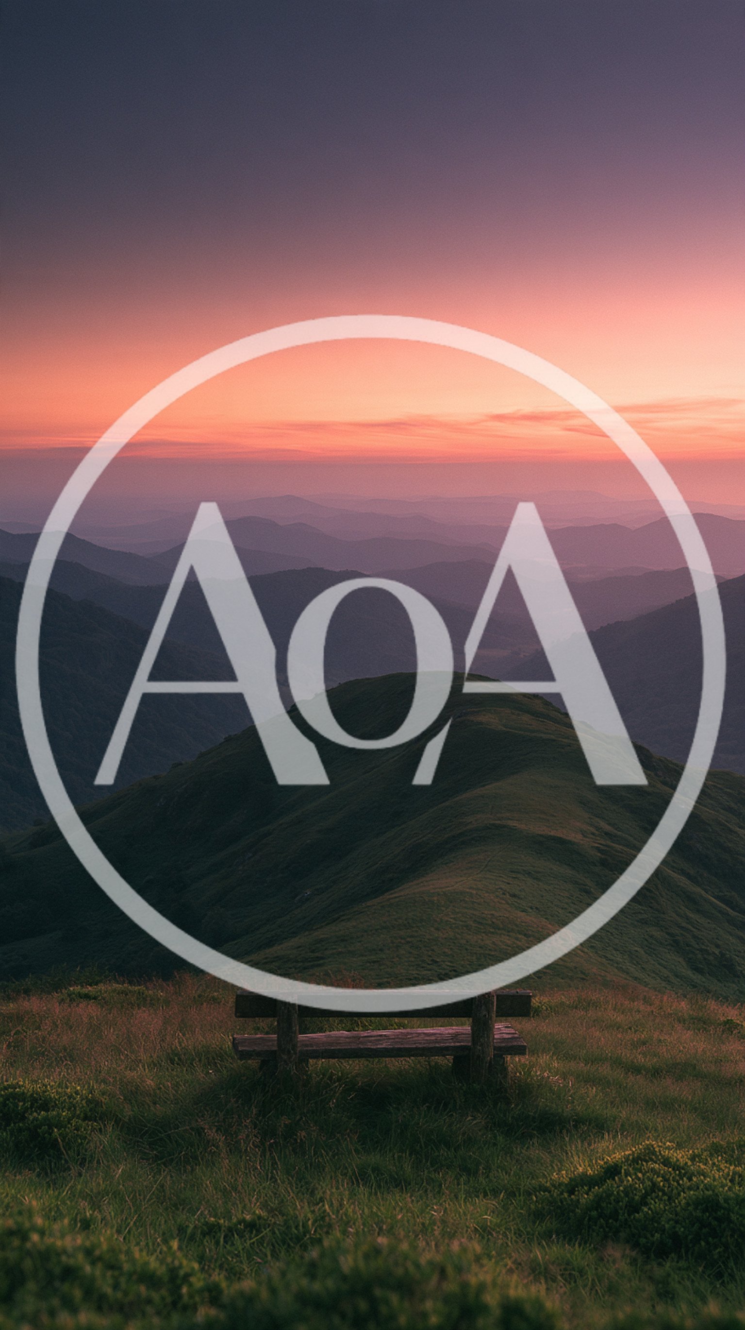 Wooden Bench Overlooking Rolling Mountain Range at Sunset