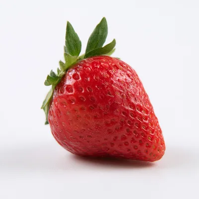 Single Fresh Red Strawberry On White Background