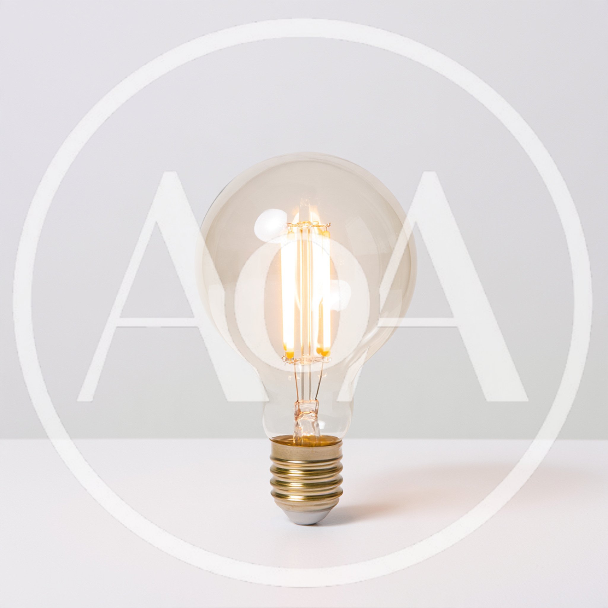 Glowing LED Filament Light Bulb On White Surface