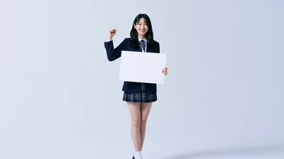 Young Student Holding Blank Sign With Cheering Gesture