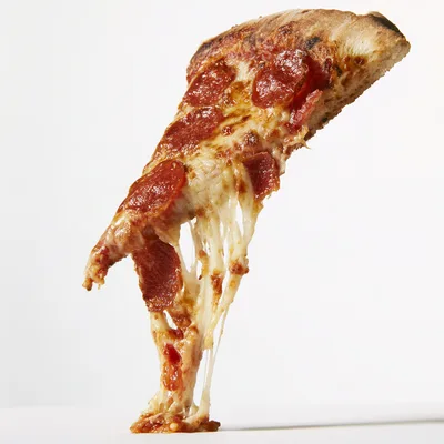 Single Slice Of Pepperoni Pizza With Melting Cheese