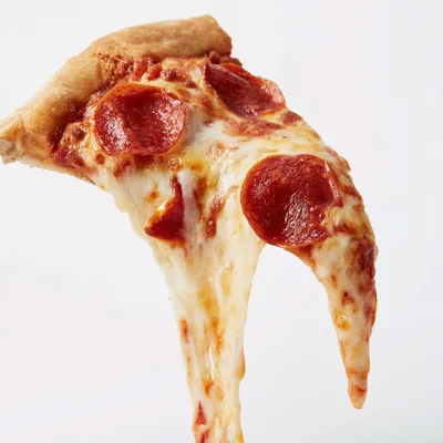 Single Slice Of Pepperoni Pizza With Melting Cheese