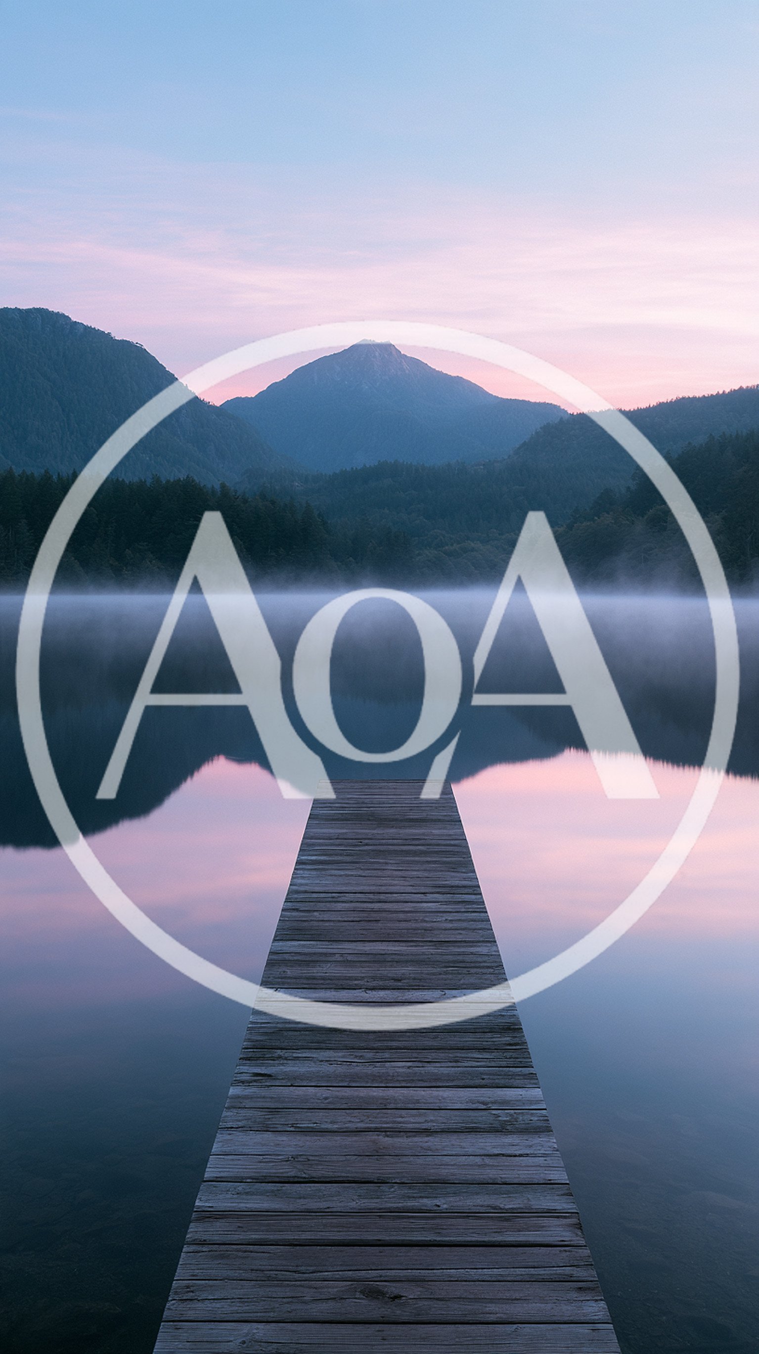 Wooden Pier Extending Into A Misty Mountain Lake