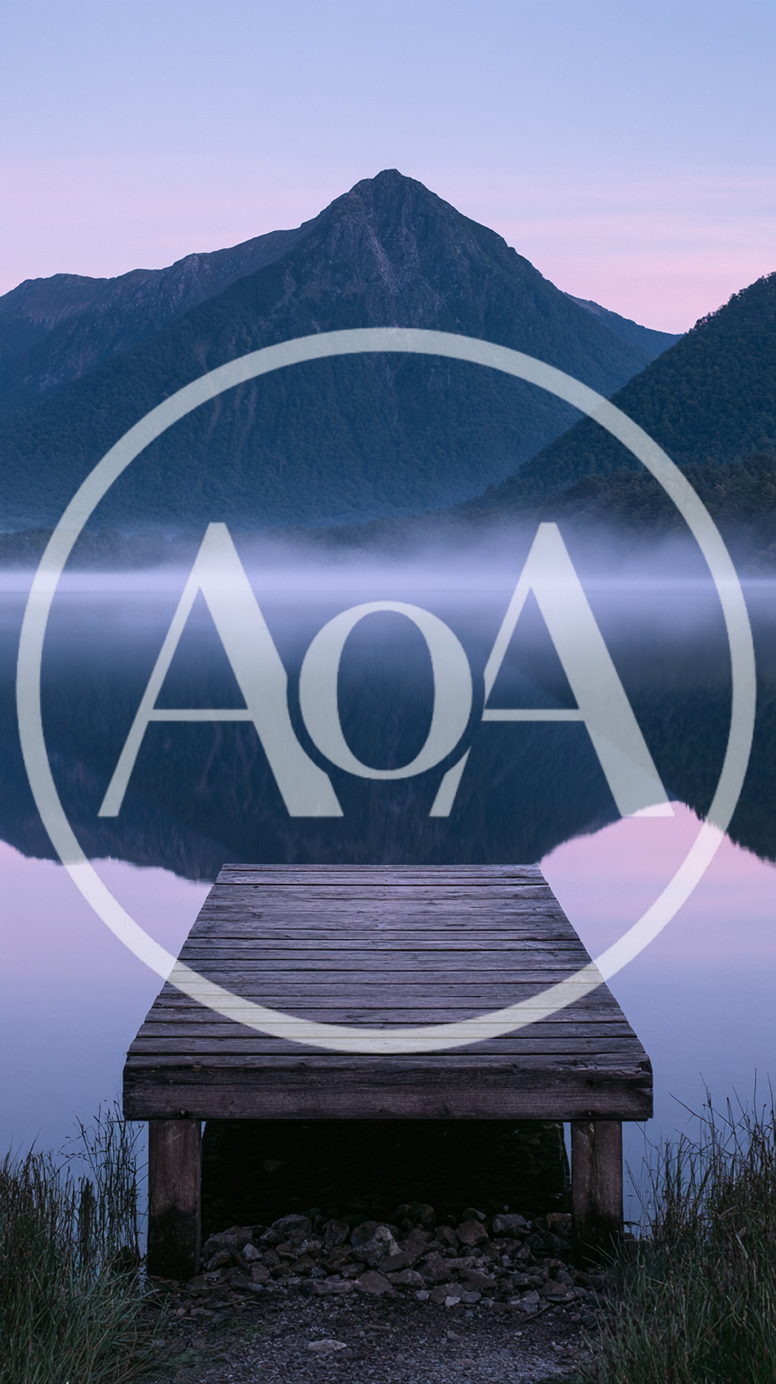 Wooden Pier Extending Into A Calm Misty Lake