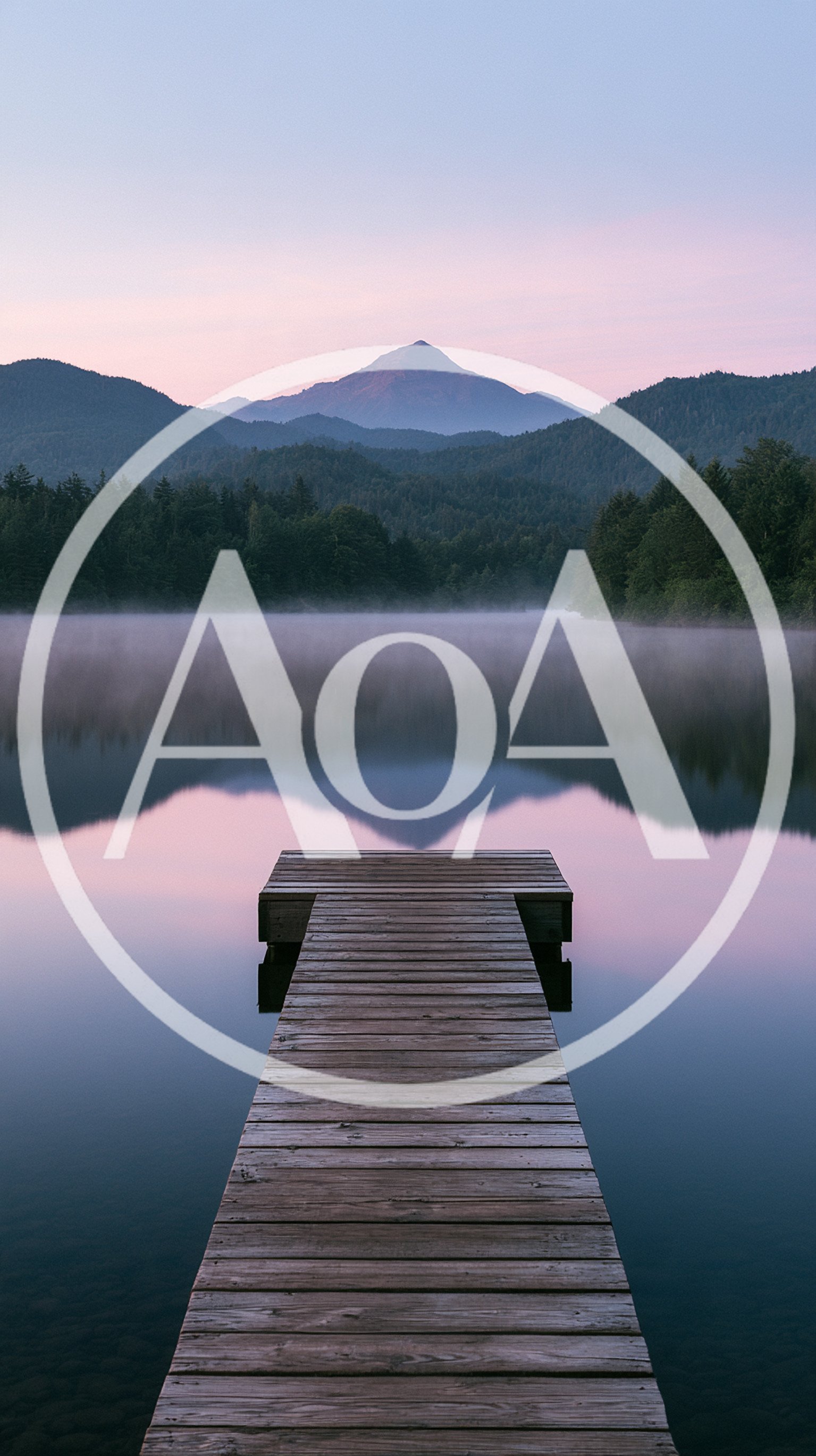 Wooden Dock Extending Into A Calm Misty Mountain Lake