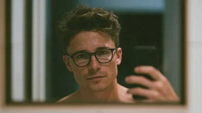 Young Man Taking A Mirror Selfie