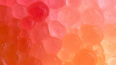 Abstract Background Of Translucent Red And Orange Gel Spheres