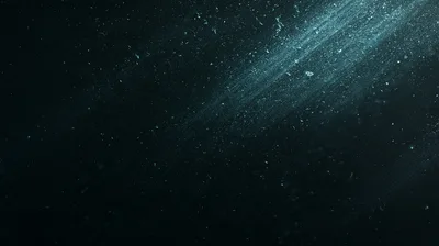 Dust Particles Floating In A Dark Blue Light Beam