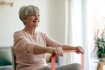Senior Woman Exercising With Resistance Band
