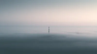 Communication Tower Rising Above A Thick Sea Of Fog