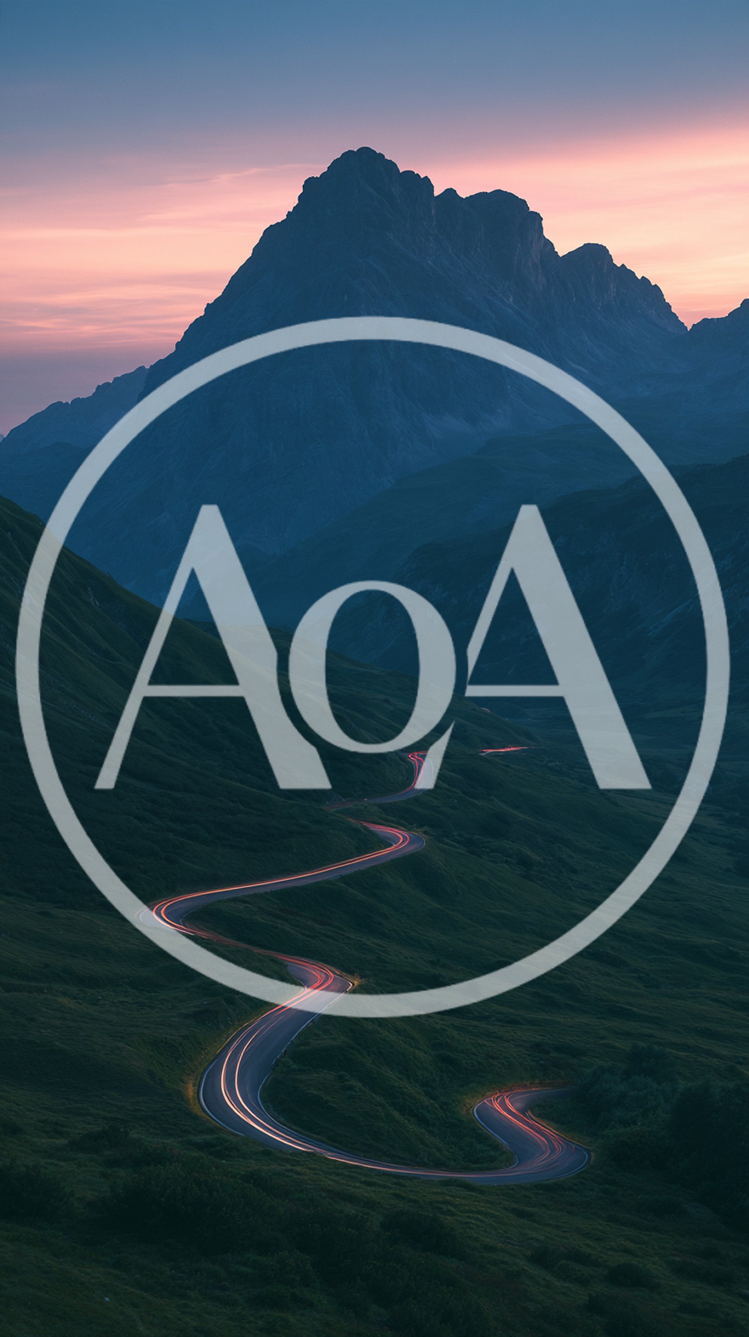Winding Mountain Road With Car Light Trails At Dusk