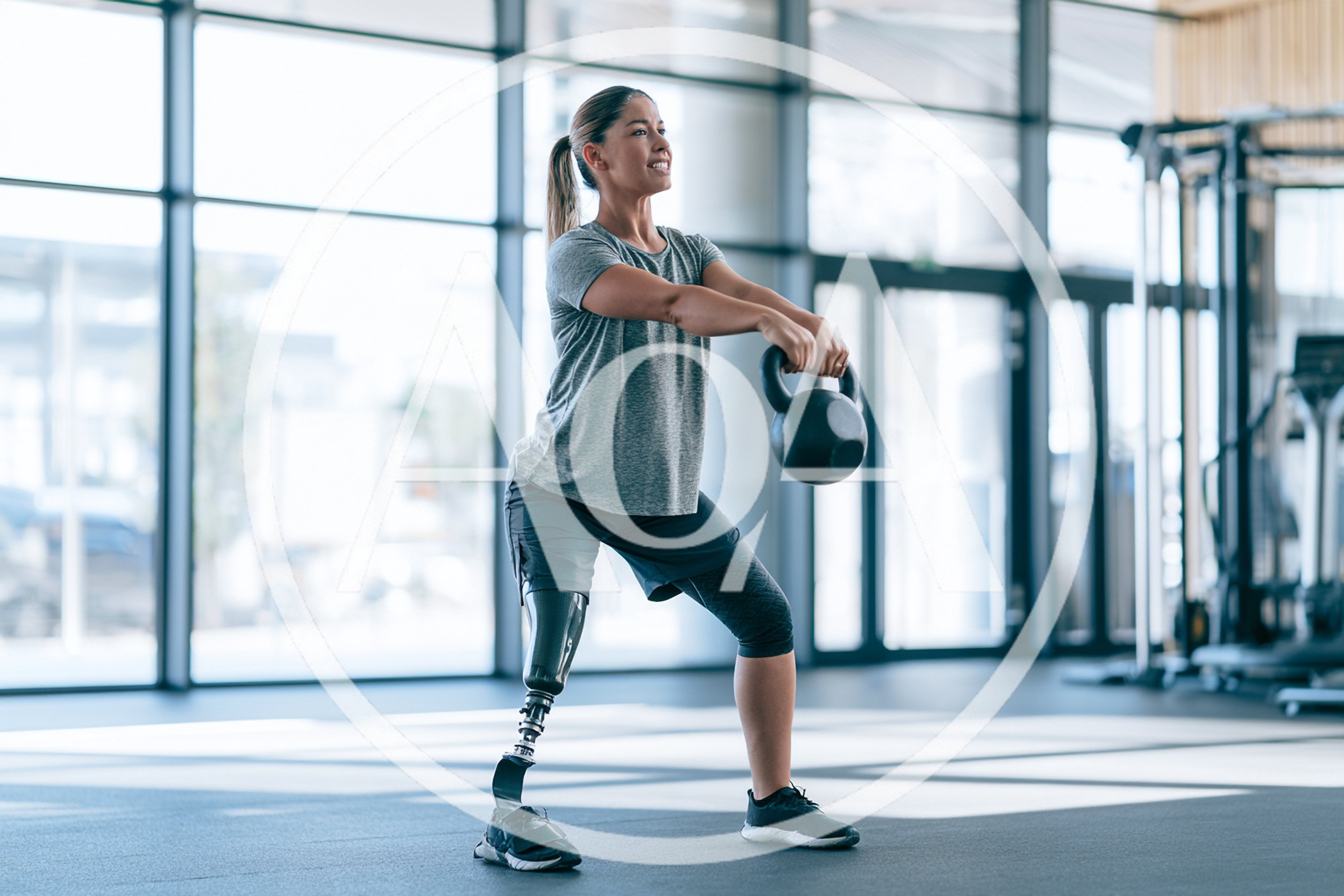Woman With Prosthetic Leg Performing Kettlebell Squats