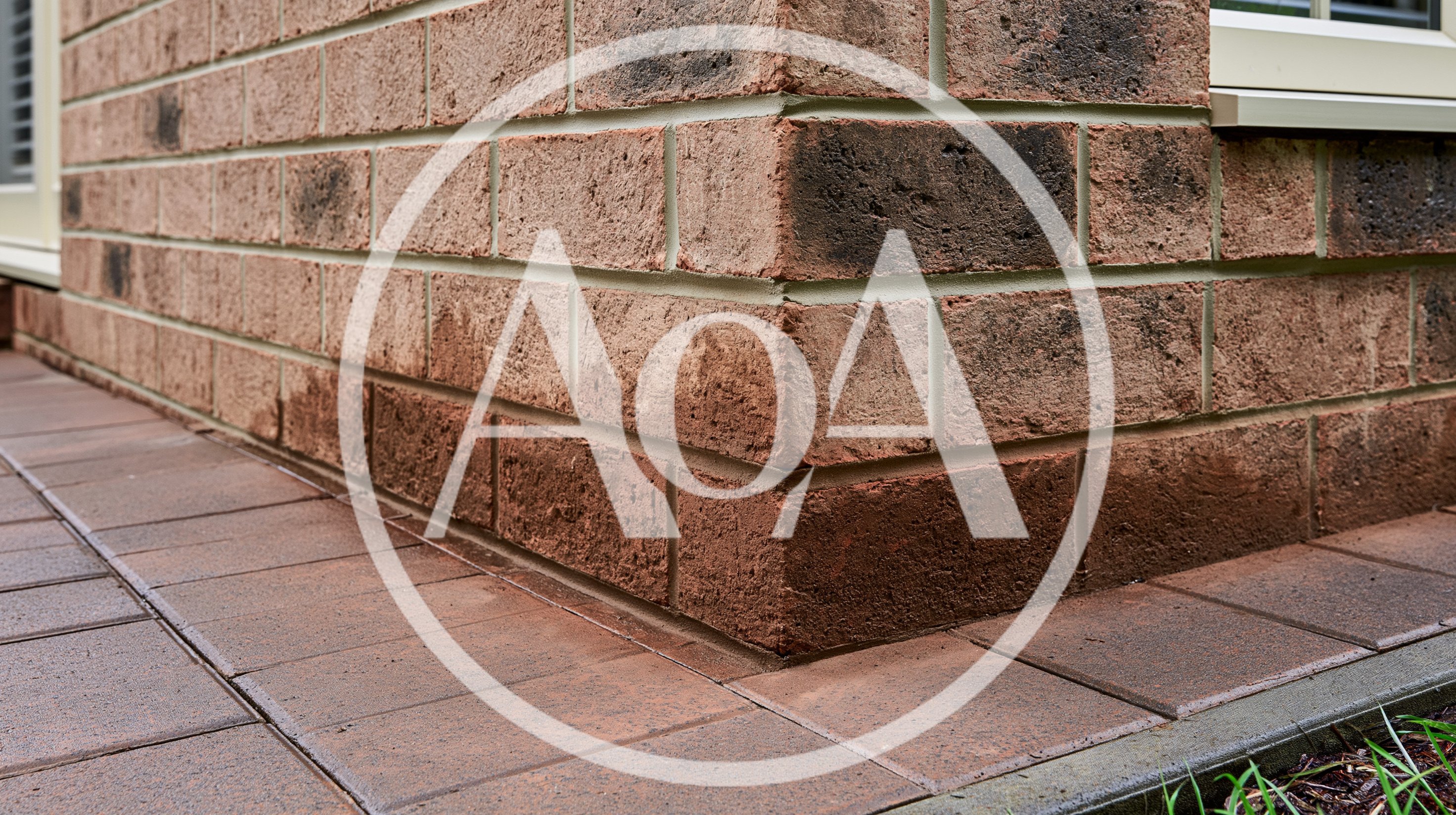 Close Up Of Exterior Brick Wall Corner And Pavers