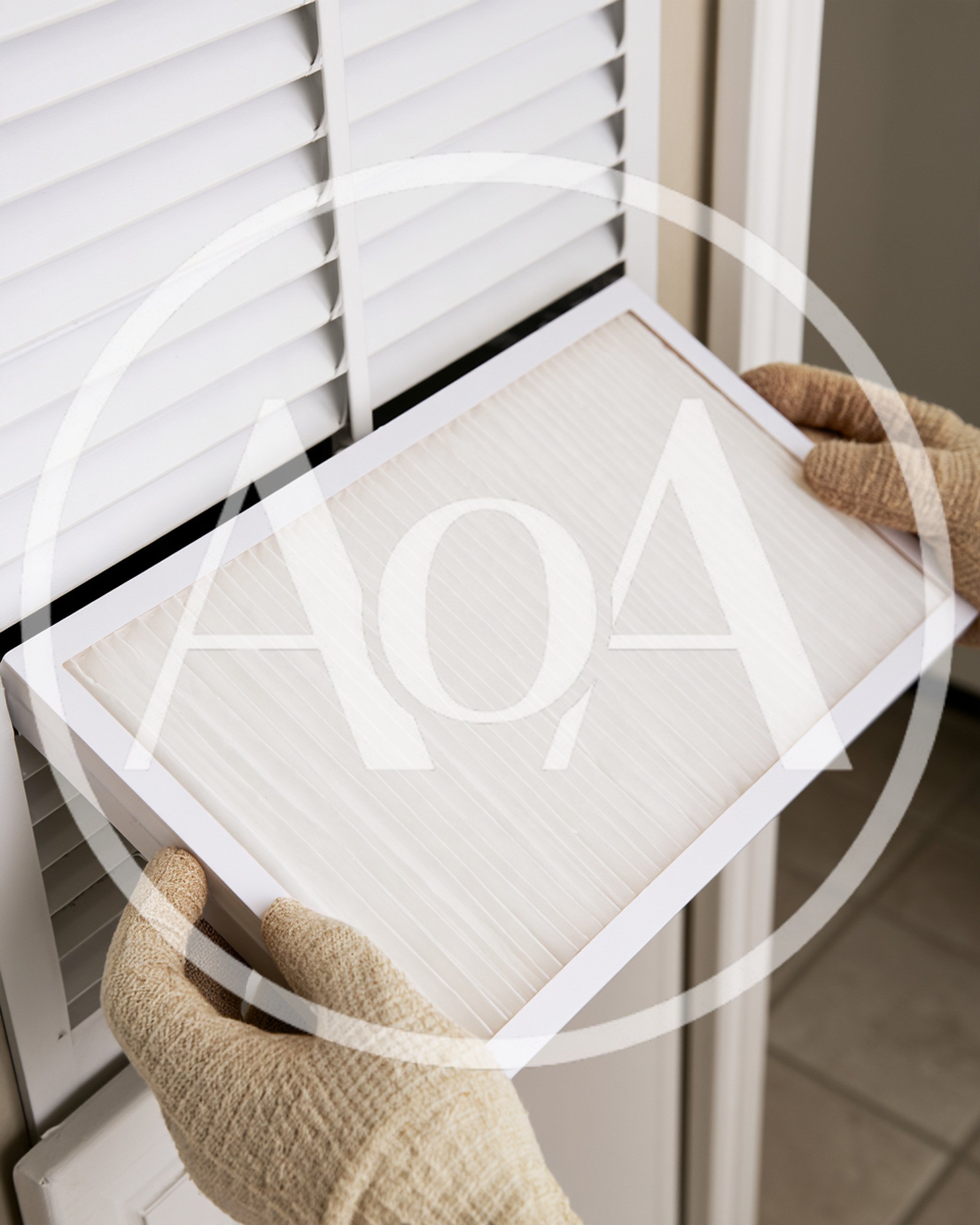 Person Replacing Air Filter In Home Vent