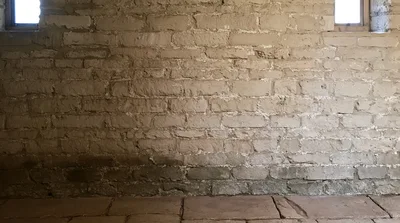 Old Stone Wall With Two Small Windows