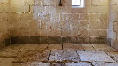 Empty Stone Prison Cell Interior